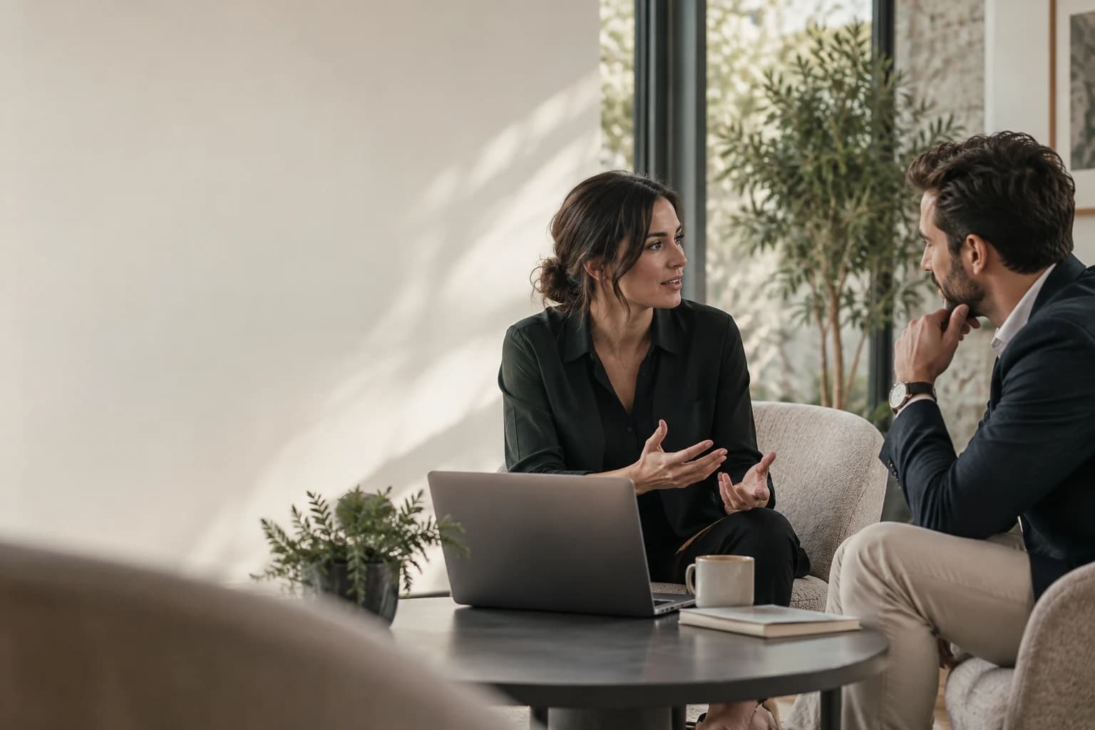 Illustrative customer conversation around an open laptop